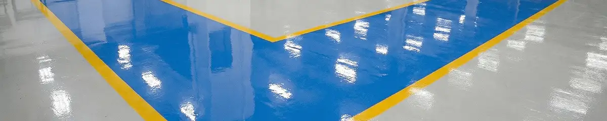 A factory floor professionally covered and marked with epoxy flooring in Houston, TX