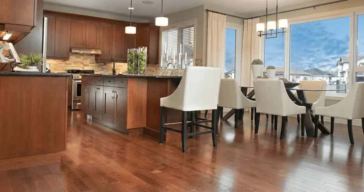 A modern kitchen with professionally installed wood flooring in Houston, TX