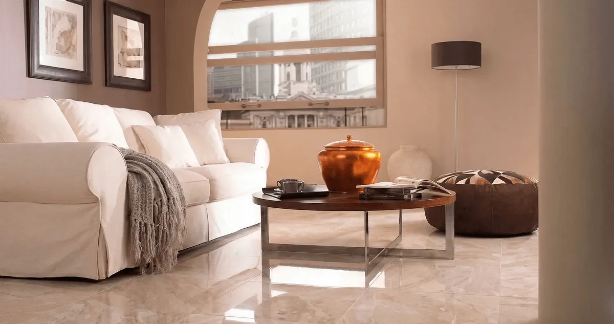 Modern living room with professionally installed marble flooring, a beige sofa, coffee table in Houston, TX