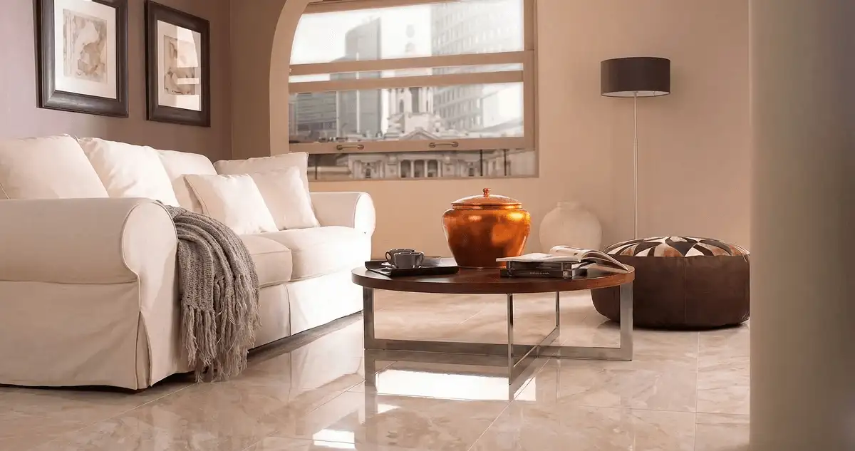 Modern living room with professionally installed marble flooring, a beige sofa, coffee table in Houston, TX