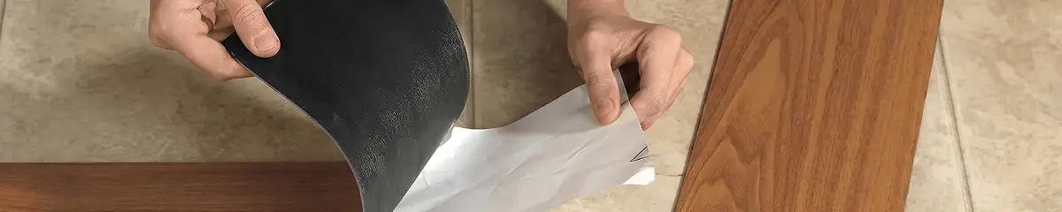 A professional installing vinyl flooring in Houston, TX